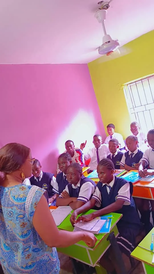 Teacher leading a discussion with secondary school pupils