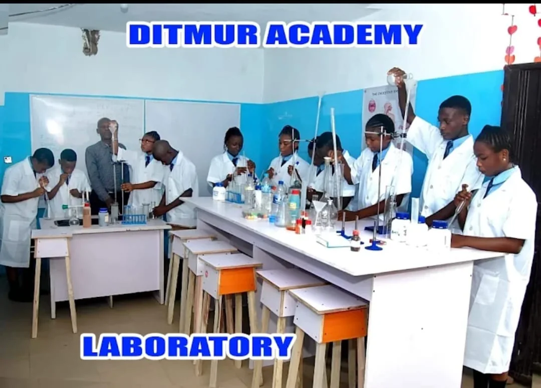 Secondary students in laboratory coats taking part in a science practical